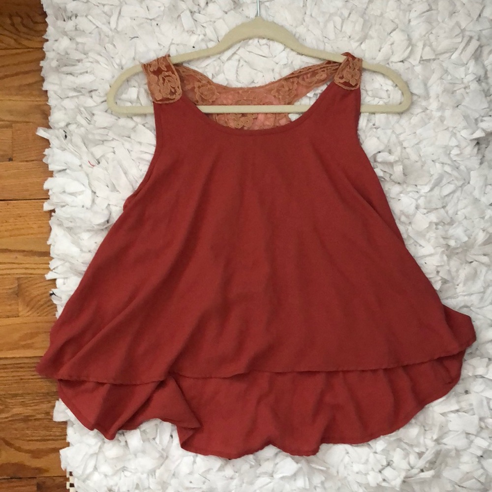 Terracotta orange blouse with lace details